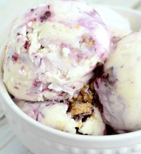 Lemon Blueberry Cheesecake Ice Cream in a bowl topped with fresh blueberries