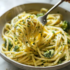 Mafaldine Pasta Limone with Broccoli in a vibrant bowl, garnished with lemon zest.