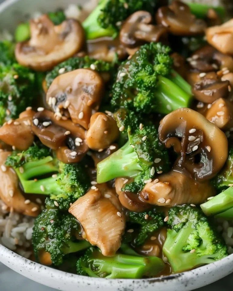 Plate of easy chicken stir-fry with broccoli and mushrooms