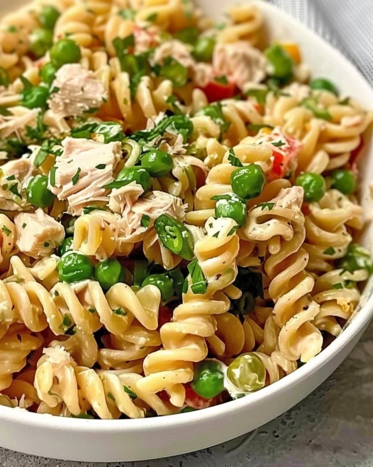 Bowl of easy tuna pasta salad with vegetables and dressing