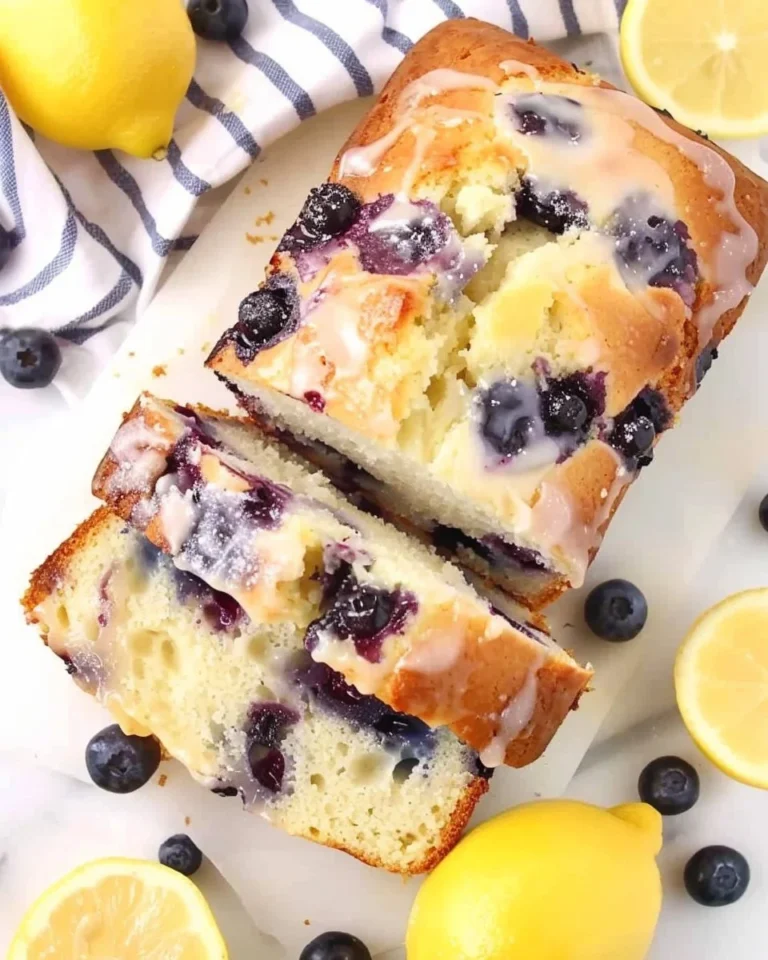 Sliced lemon blueberry bread with a moist texture and vibrant blueberries