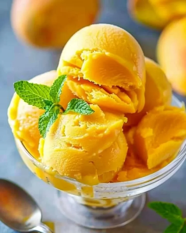 Delicious mango sorbet served in a bowl, perfect for a refreshing dessert.