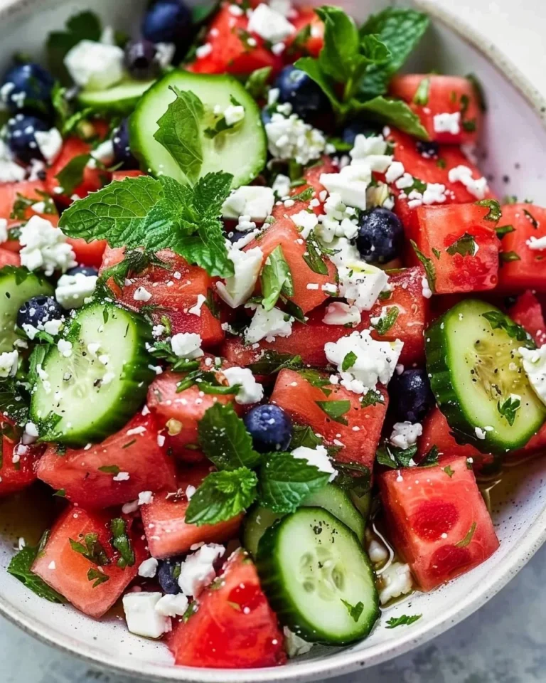 Watermelon and Cucumber Feta Salad in a bowl with fresh ingredients