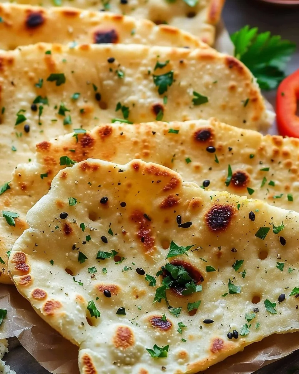 Homemade Cottage Cheese Flatbread garnished with herbs and served with dips.