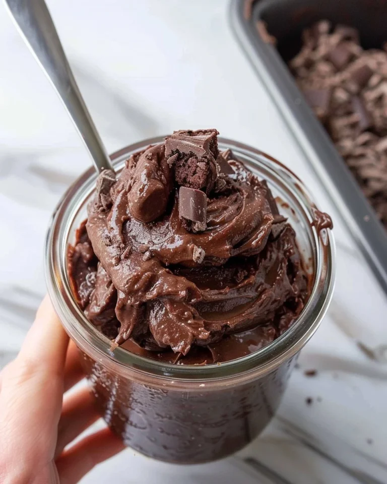 Bowl of edible brownie batter made with chocolate and ingredients for safe eating.