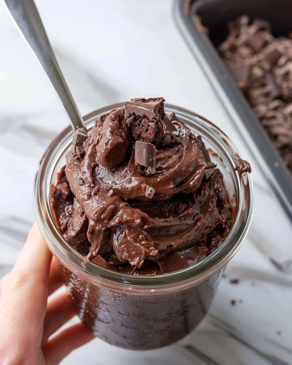 Bowl of edible brownie batter made with chocolate and ingredients for safe eating.
