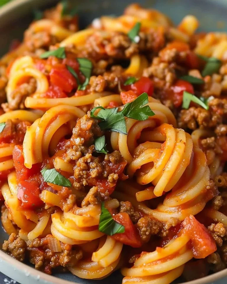 High-protein taco pasta dish with colorful ingredients served in a bowl