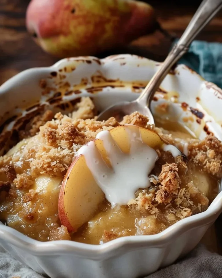 Delicious homemade old-fashioned pear crumble served in a rustic dish.